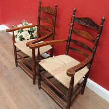 Load image into Gallery viewer, Pair of Antique French Carver Chairs with Rush Seats and Carved Ladder Backs. B12693