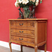 Load image into Gallery viewer, Vintage French chest of three drawers with carved detail and cast metal handles. B12824