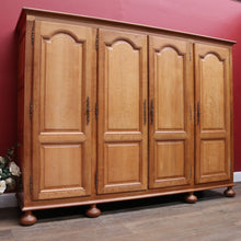 Load image into Gallery viewer, Antique French Oak 4 Door Armoire/ Wardrobe with hanging space shelves and three keys. B12743