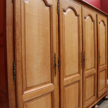 Load image into Gallery viewer, Antique French Oak 4 Door Armoire/ Wardrobe with hanging space shelves and three keys. B12743