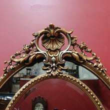 Load image into Gallery viewer, Vintage French Giltwood Oval Cushion Mirror with Silver Toned Cherubs and Rococo Gold Leaf Detail. B13047