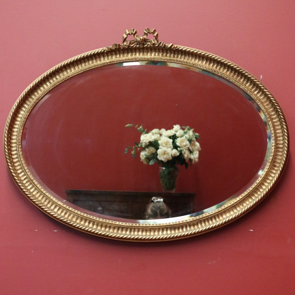 Vintage French Gilt Bevelled Edge Oval Wall Mirror with Ribbon Bow to the top. B12062