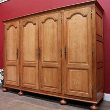 Load image into Gallery viewer, Antique French Oak 4 Door Armoire/ Wardrobe with hanging space shelves and three keys. B12743

