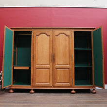 Load image into Gallery viewer, Antique French Oak 4 Door Armoire/ Wardrobe with hanging space shelves and three keys. B12743
