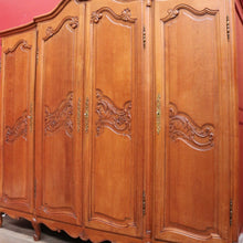 Load image into Gallery viewer, Antique French oak wardrobe / armoire with breakfront centre and fitted interior. B12722
