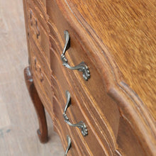 Load image into Gallery viewer, Vintage French chest of drawers with shaped front and brass handles. B12823
