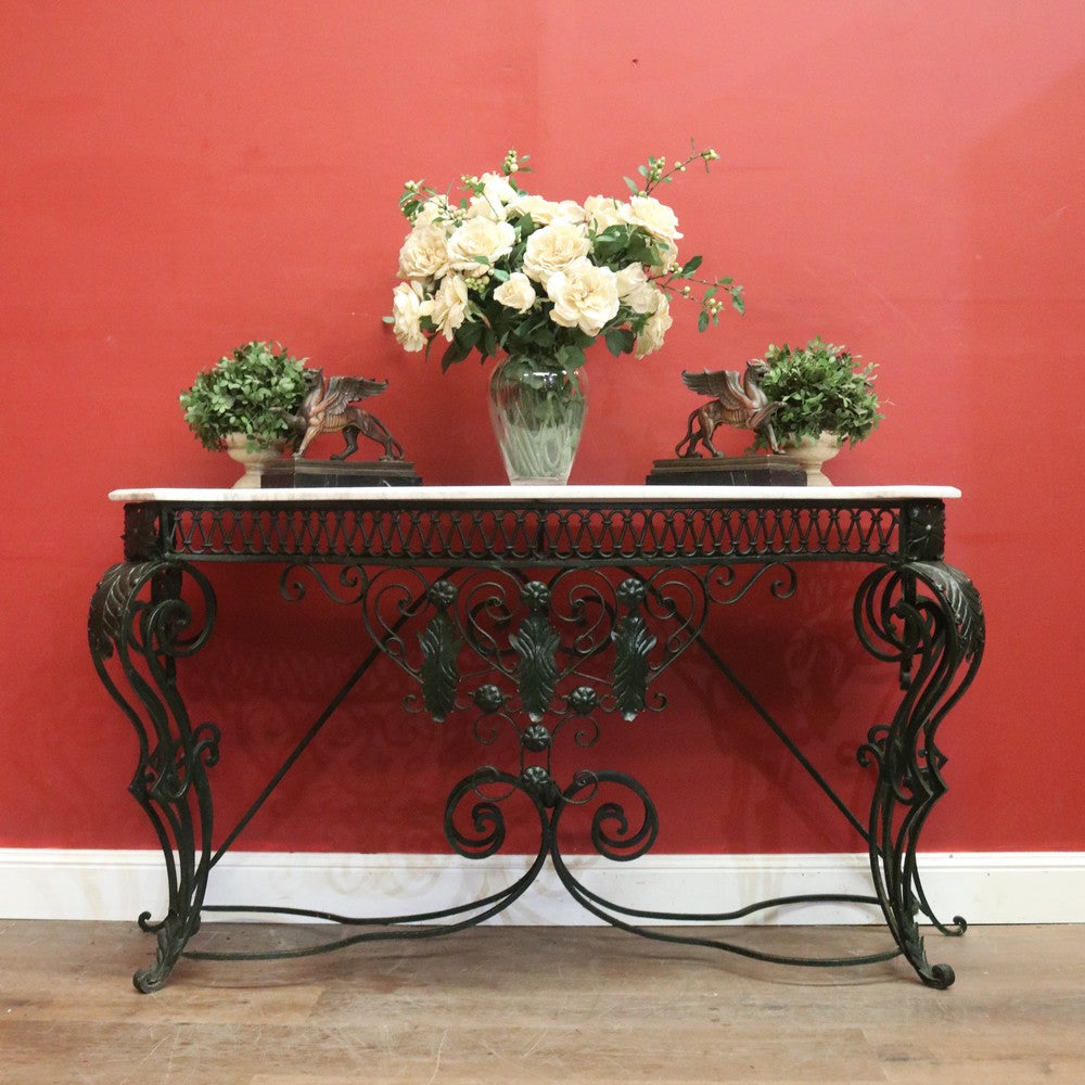 French wrought iron and marble top hall console table with scrollwork base. B12636