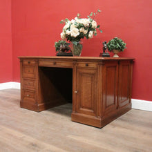 Load image into Gallery viewer, Antique English oak and tan leather office desk with drawers and cupboard. B12635
