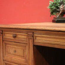 Load image into Gallery viewer, Antique English oak and tan leather office desk with drawers and cupboard. B12635
