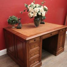 Load image into Gallery viewer, Antique English oak and tan leather office desk with drawers and cupboard. B12635
