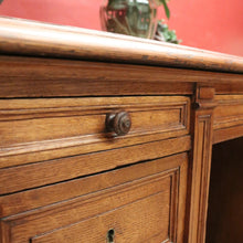 Load image into Gallery viewer, Antique English oak and tan leather office desk with drawers and cupboard. B12635
