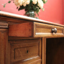 Load image into Gallery viewer, Antique English oak and tan leather office desk with drawers and cupboard. B12635
