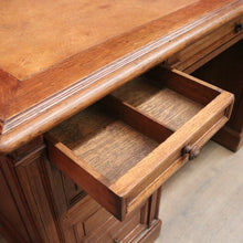 Load image into Gallery viewer, Antique English oak and tan leather office desk with drawers and cupboard. B12635

