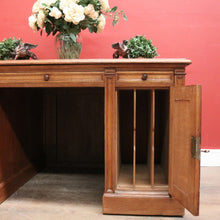 Load image into Gallery viewer, Antique English oak and tan leather office desk with drawers and cupboard. B12635
