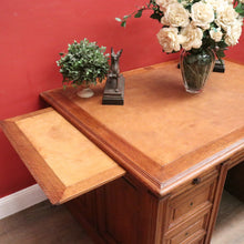 Load image into Gallery viewer, Antique English oak and tan leather office desk with drawers and cupboard. B12635
