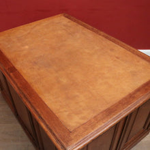 Load image into Gallery viewer, Antique English oak and tan leather office desk with drawers and cupboard. B12635
