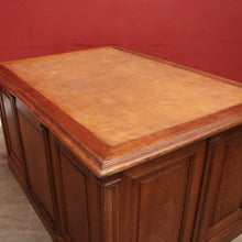 Load image into Gallery viewer, Antique English oak and tan leather office desk with drawers and cupboard. B12635
