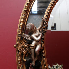 Load image into Gallery viewer, Vintage French Giltwood Oval Cushion Mirror with Silver Toned Cherubs and Rococo Gold Leaf Detail. B13047
