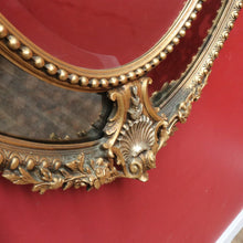 Load image into Gallery viewer, Vintage French Giltwood Oval Cushion Mirror with Silver Toned Cherubs and Rococo Gold Leaf Detail. B13047
