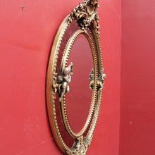 Load image into Gallery viewer, Vintage French Giltwood Oval Cushion Mirror with Silver Toned Cherubs and Rococo Gold Leaf Detail. B13047
