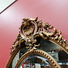 Load image into Gallery viewer, Vintage French Giltwood Oval Cushion Mirror with Silver Toned Cherubs and Rococo Gold Leaf Detail. B13047
