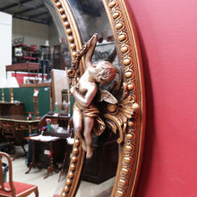 Load image into Gallery viewer, Vintage French Giltwood Oval Cushion Mirror with Silver Toned Cherubs and Rococo Gold Leaf Detail. B13047
